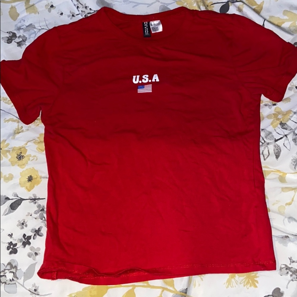 A red U.S.A short sleeved shirt.